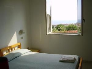 Postel nebo postele na pokoji v ubytování Albergo Marla