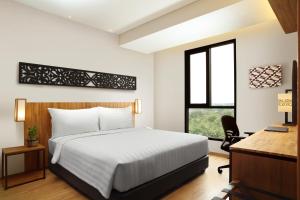 BATIQA Hotel Pekanbaru客房内的一张或多张床位