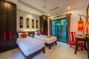 Ένα ή περισσότερα κρεβάτια σε δωμάτιο στο The Bell Pool Villa Resort Phuket +33 φωτογραφίες