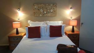 Postel nebo postele na pokoji v ubytování Heta Road B&B