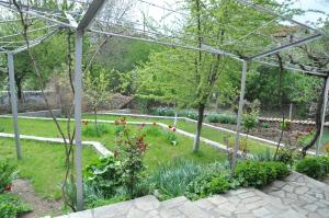 A garden outside Holiday Home Vilata