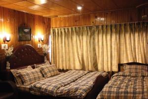 Кровать или кровати в номере Walisons Peace Resort