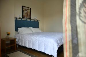 Postel nebo postele na pokoji v ubytování Hotel Hercules