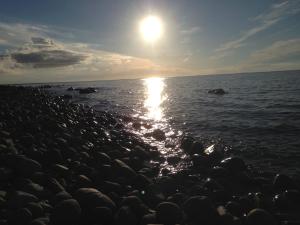 a group of rocks on the shore of the ocean at Fewo's Kiekut in Lohme