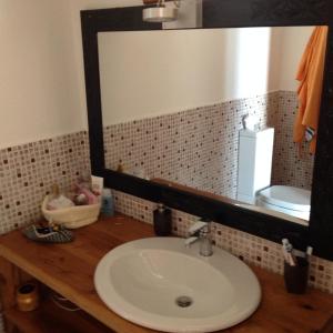 a bathroom with a sink and a mirror on a counter at Villa Marisella in Kiwengwa +19 photos