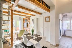 a kitchen and dining room with a table and chairs at Villa Marizella in Premantura