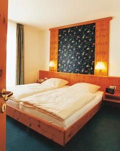 Postel nebo postele na pokoji v ubytování Posthotel Usseln
