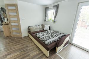 Postel nebo postele na pokoji v ubytování Lesní Penzion Vranov