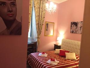 A bed or beds in a room at Guest House Biondi