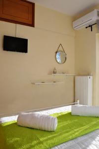 Postel nebo postele na pokoji v ubytování Sofoklis Apts