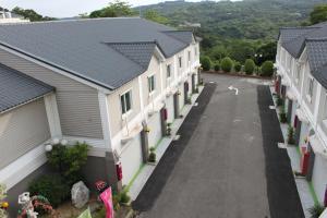 arial view of a row of houses on a street at Milan Motel in Miaoli