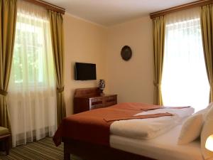 Posteľ alebo postele v izbe v ubytovaní Parkhotel Forest