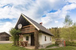 a building with a picnic table in front of it at Holiday Homes Sara in Bled