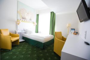 Postel nebo postele na pokoji v ubytování Hotel König Ludwig II