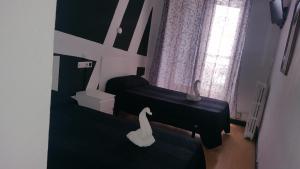 Postel nebo postele na pokoji v ubytování Hostal Lima