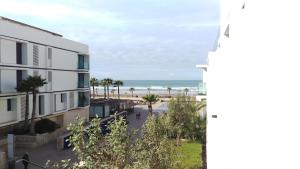 a view of the beach from the balcony of a building at Anfa Place in Casablanca