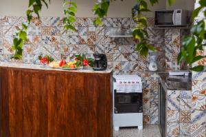 a kitchen with a counter with fruit on it at Vila Mar in Fernando de Noronha