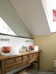 a bathroom with two sinks on a wooden table at The Brook in Killyhevlin