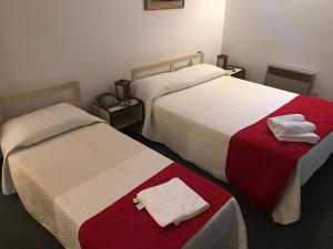 Postel nebo postele na pokoji v ubytování Hotel Antares