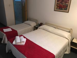 Postel nebo postele na pokoji v ubytování Hotel Antares