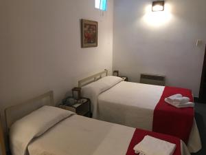 Postel nebo postele na pokoji v ubytování Hotel Antares