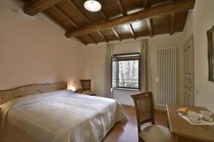 A bed or beds in a room at Casa Pescaglia