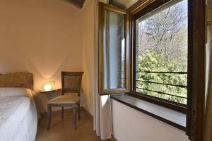 A bed or beds in a room at Casa Pescaglia