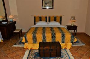 a bedroom with a bed and two night stands and two lamps at GB Apartments - Belle Epoque in Arad