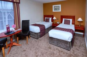 Krevet ili kreveti u jedinici u okviru objekta Eviston House Hotel
