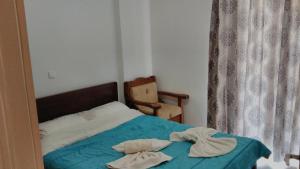 Postel nebo postele na pokoji v ubytování Lerna Rooms