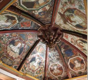 a ceiling with paintings on it with a chandelier at Chateau De La Caze in Sainte-Énimie