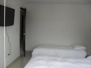 Postel nebo postele na pokoji v ubytování A Bogota On Holidays by Open - HOTEL CAS-EMBAJADA AMERICANA