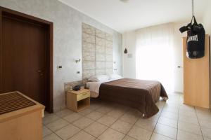 Posteľ alebo postele v izbe v ubytovaní Hotel Villa Cesare B&B