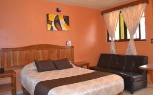 Ένα ή περισσότερα κρεβάτια σε δωμάτιο στο Hotel Márquez