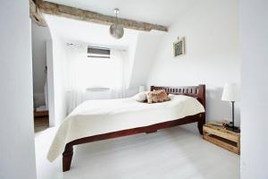 Tempat tidur dalam kamar di Schuhmacherei Guesthouse
