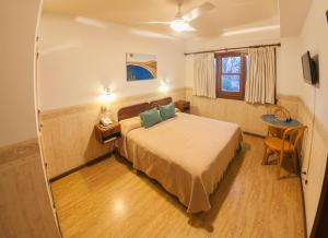 En eller flere senge i et værelse på Hotel Bahia Nueva