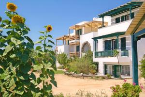 a view of a building with a sunflower at Elpidas studios in Agia Anna Naxos