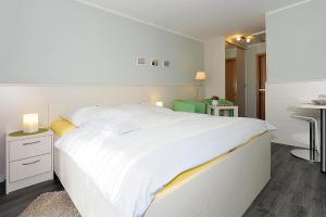 Postel nebo postele na pokoji v ubytování Hotel garni Haus am Meer
