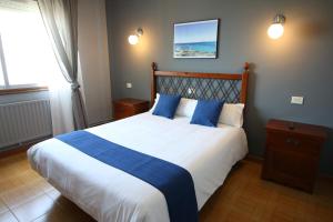 Postel nebo postele na pokoji v ubytování Hotel Alda Bueumar