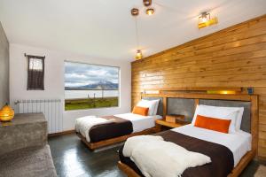 Ένα ή περισσότερα κρεβάτια σε δωμάτιο στο Hotel Altiplanico Puerto Natales