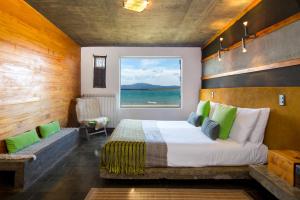 Ένα ή περισσότερα κρεβάτια σε δωμάτιο στο Hotel Altiplanico Puerto Natales