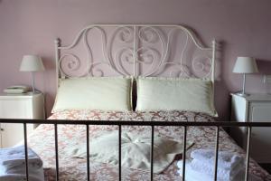 Postel nebo postele na pokoji v ubytování Relais CastelBigozzi