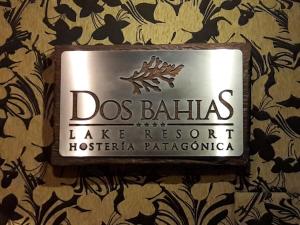 a sign on the wall of a hotel room at Dos Bahias Lake Resort in Villa La Angostura