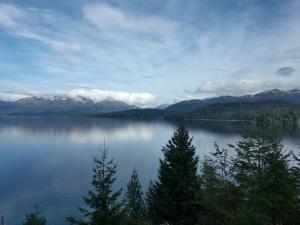 a view of a lake with mountains in the background at Dos Bahias Lake Resort in Villa La Angostura