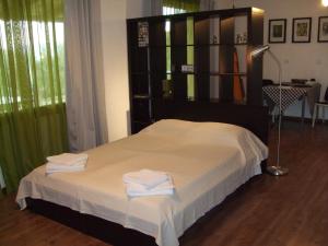 Ένα ή περισσότερα κρεβάτια σε δωμάτιο στο Alilea