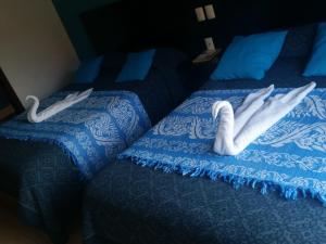 Postel nebo postele na pokoji v ubytování Hotel Real Colonial