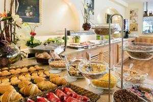 a buffet with many different types of food on a table at Nura Santa Ponsa & Spa in Santa Ponsa