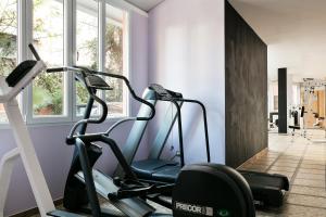 a room with a gym with a treadmill at Nura Santa Ponsa & Spa in Santa Ponsa