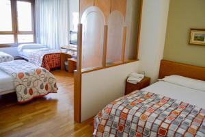 Posteľ alebo postele v izbe v ubytovaní Pension Payvi
