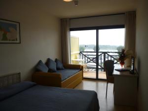 Postel nebo postele na pokoji v ubytování Hotel Marina Uno